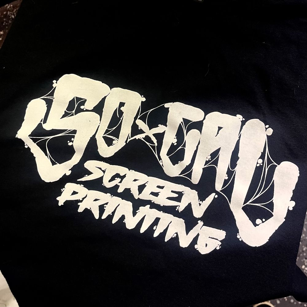 SoCal Screen Printing graffiti script logo printed in white on a black shirt